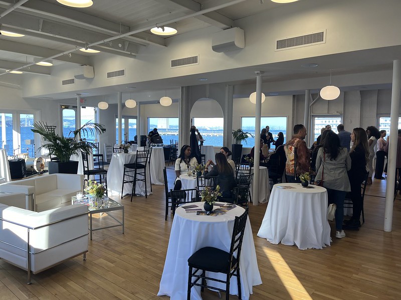 cocktail party with sofas and palms and view of bay bridge