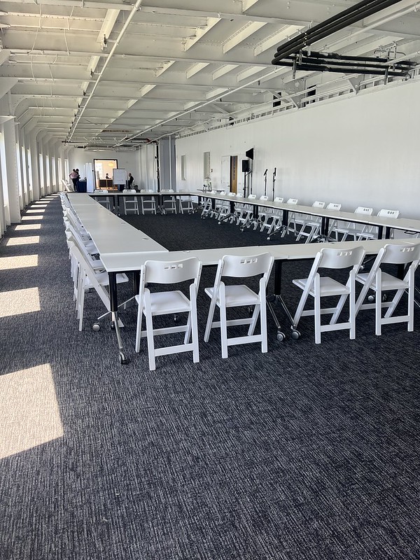 sunny view of board room with meeting table and chairs